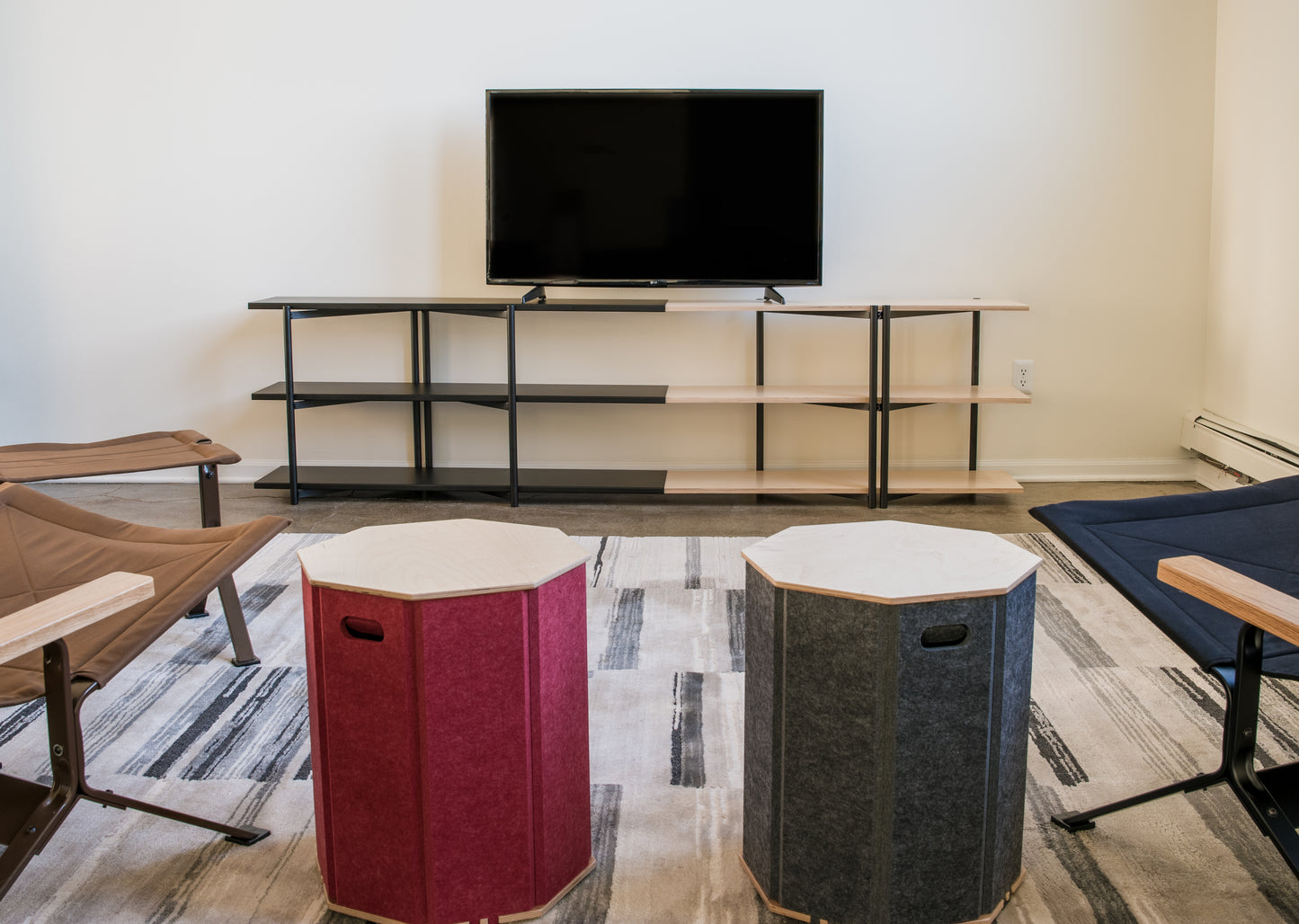 FLO Media Modular Shelving – lifestyle front view, black frame with TV mounted