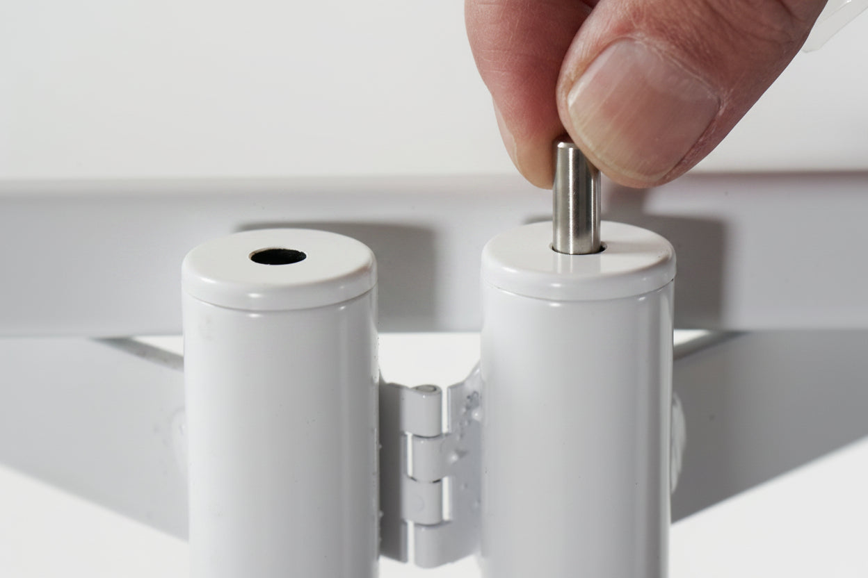 FLO Modular Shelving – close-up top view of ladder frame caps with pin being inserted